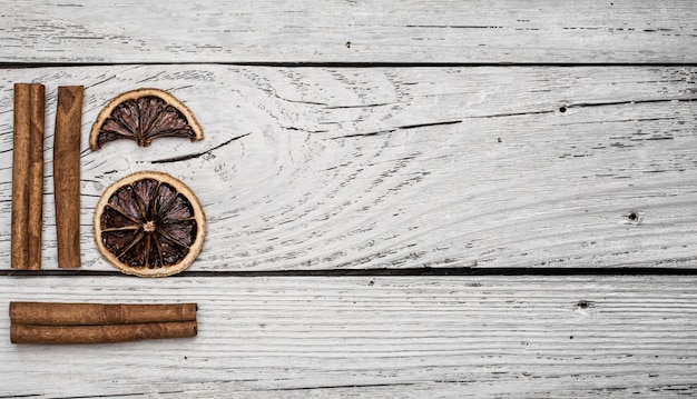 dried lemon and cinnamon on a beautiful wood