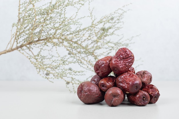 Free photo dried oleaster fruits on white surface