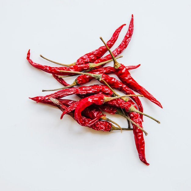 Dried red chilies on white background