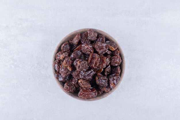 Dried sour cherries isolated in a plate on the background. High quality photo