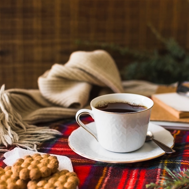 Drink and cookies near scarf