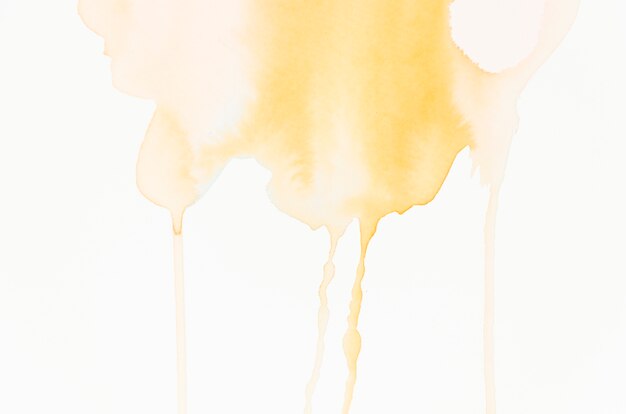 Dripping watercolor splash on white background