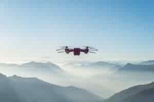 Free photo drone flying over foggy and snowy high hills and mountains