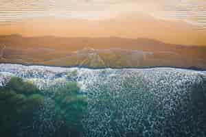 Free photo drone view of the beautiful beach with crystal clear water