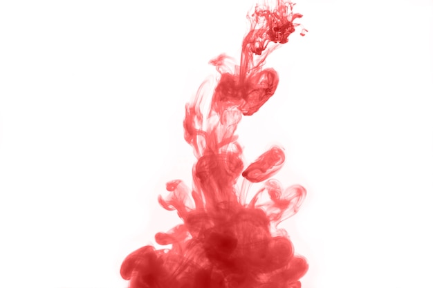 Free photo drop of red dye on white