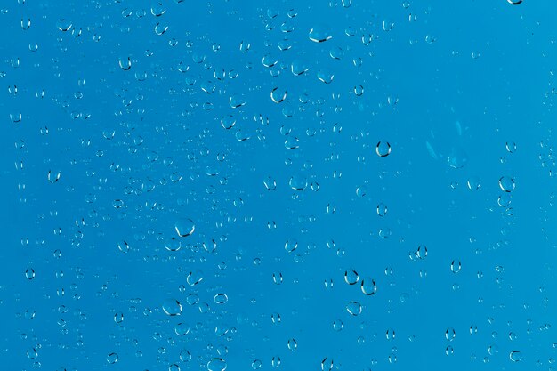 Drops of water on blue