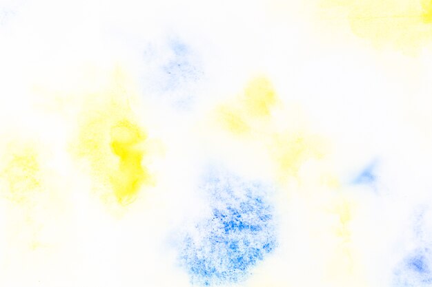 Drops of yellow and blue paint