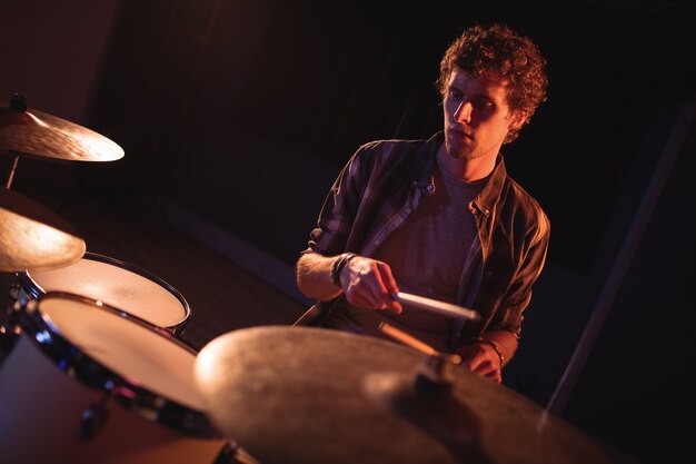 Drummer playing on drum set