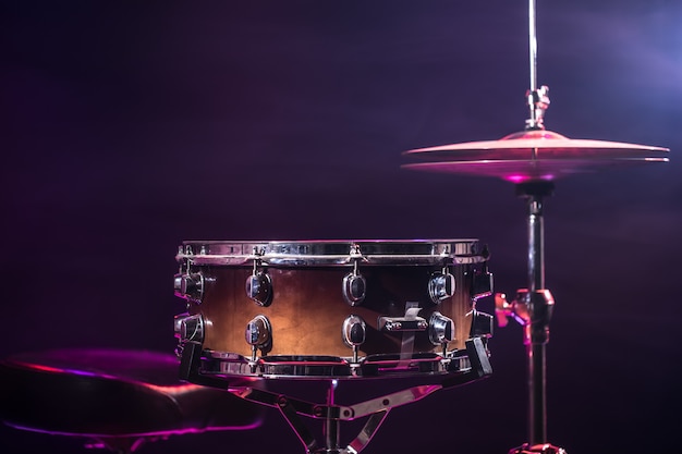 Drums and drum set. Beautiful blue and red background, with rays of light