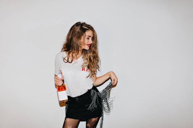 Drunk woman in black skirt having fun after party