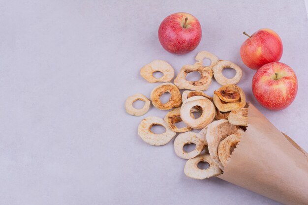 Dry apple slices in a rustic paper wrap like a bouquet