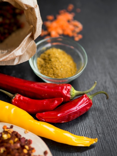 Dry chilli with spices on black background