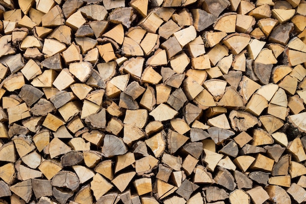 Free photo dry chopped firewood logs ready for winter