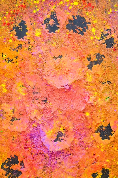 Dry colourful powder on table