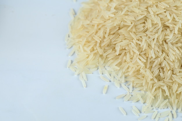 Dry and fresh asian rice stock on the right side of the marble surface