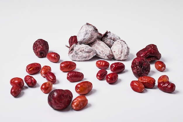 Dry fruits on white.