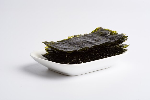 Dry seaweed on white background