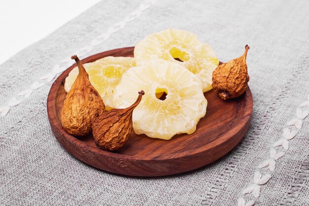 Dry sliced fruits on white.