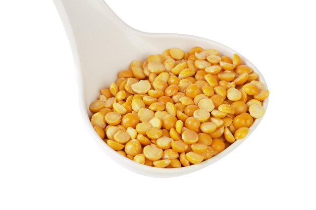 Dry yellow split peas isolated on white