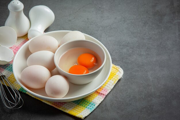 Duck eggs on dark surface