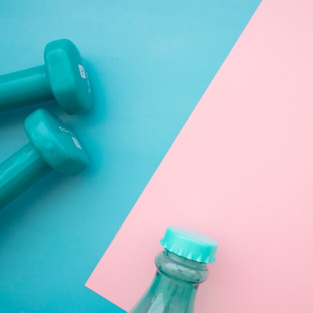 Dumbbells and bottle closeup