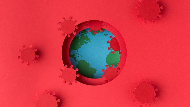 Бесплатное фото Земной шар из бумаги с коронавирусами