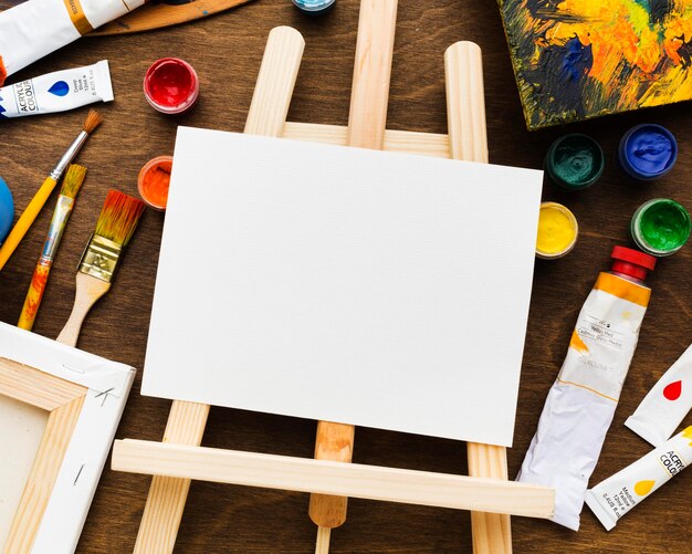 Easel and copy space white canvas