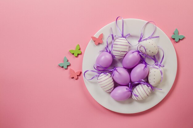 Easter background with decorative eggs on a plate