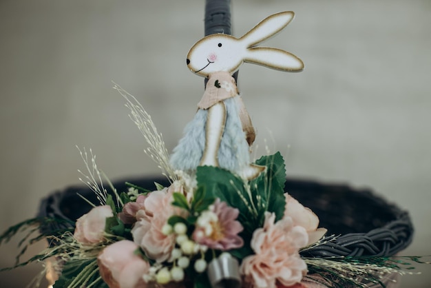 Easter bunny hanging on the decorated easter basket