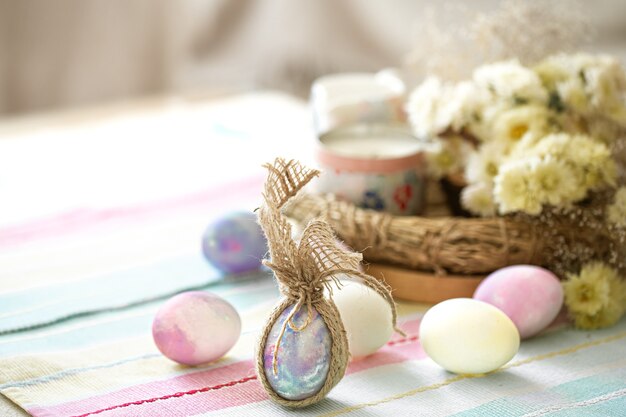 Easter composition with festive eggs on blurred space close up.