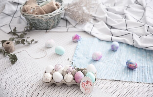 Easter composition with a tray of festive eggs and decorative elements