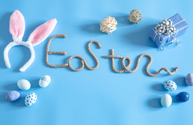 Free photo easter creative inscription on a blue background.