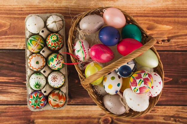 Easter eggs in basket and carton