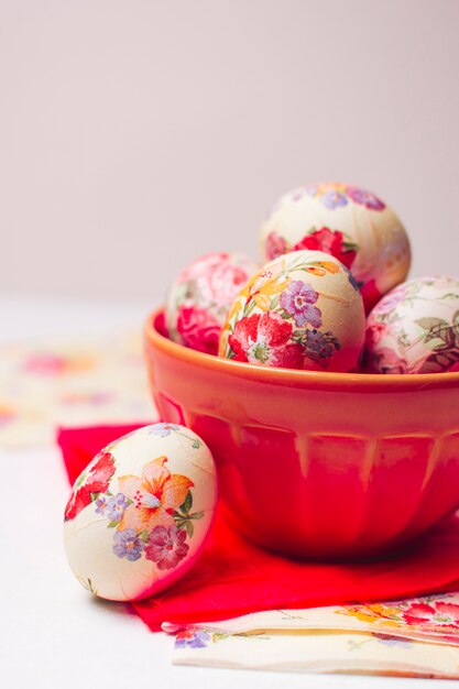 Easter eggs in bowl near napkins