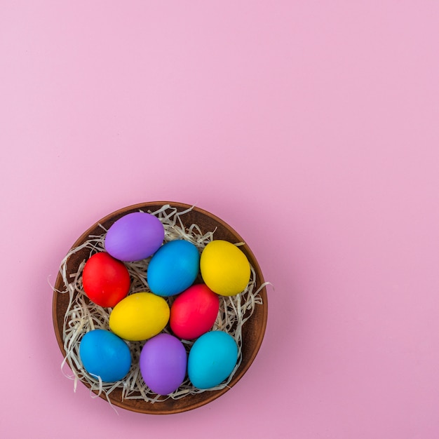 Easter eggs in bowl on table