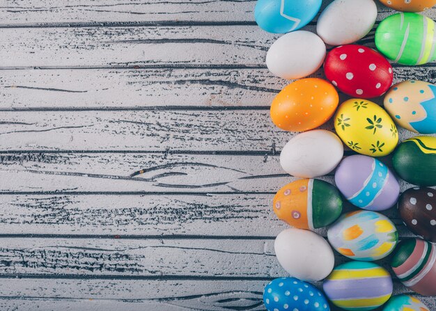 Easter eggs on light wooden background.