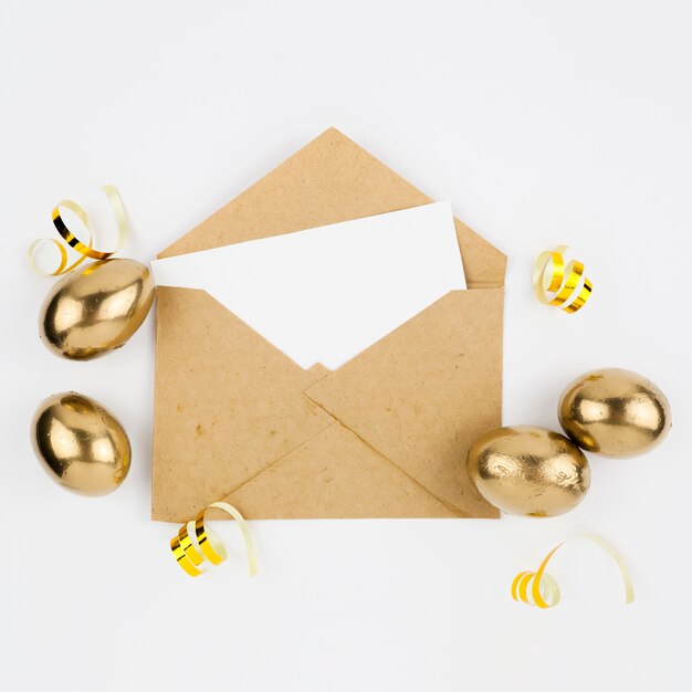 Easter eggs near envelope