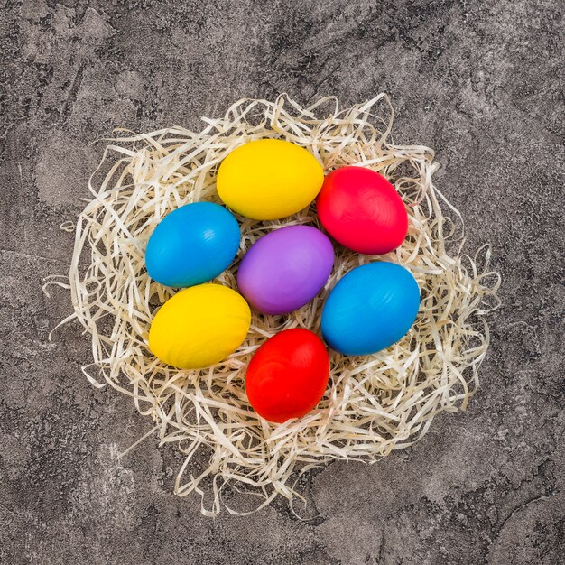 Easter eggs in nest on table