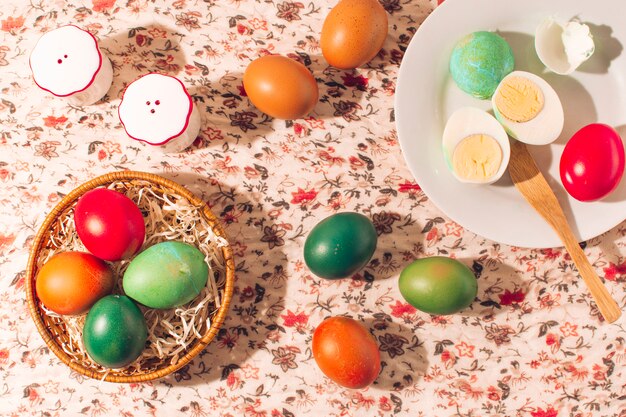 Easter eggs on plates near salt and pepper cans