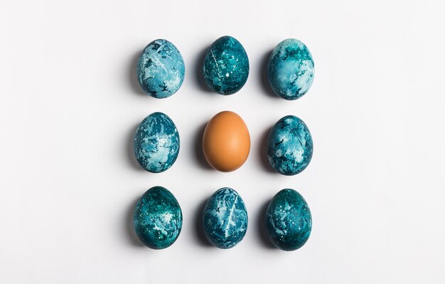 Easter eggs row isolated painted by handin blue