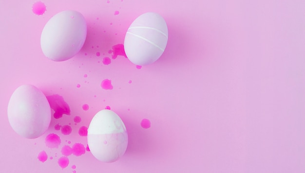 Easter eggs between splashes of dye liquid