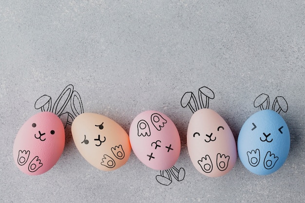 Free photo easter eggs with painted funny faces