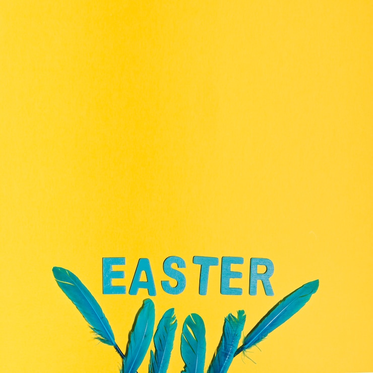 Free Photo easter inscription with feathers on table