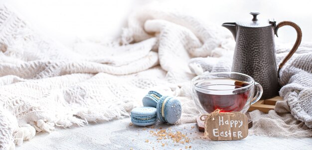 Easter mood, Cozy Easter still life with decor by the window. Morning tea with dessert.