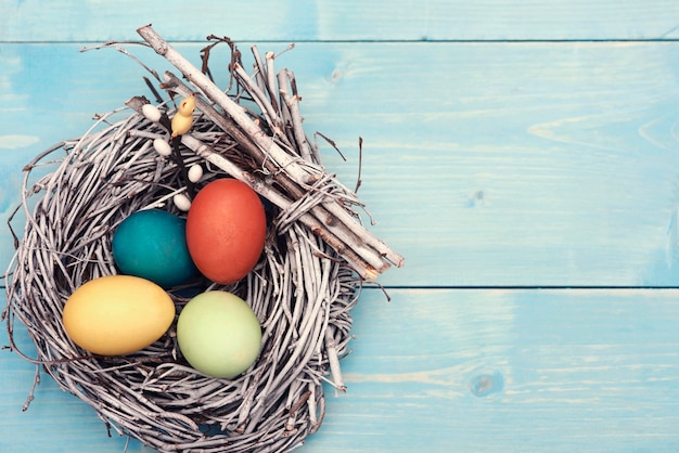 Free photo easter nest with multi colorful eggs