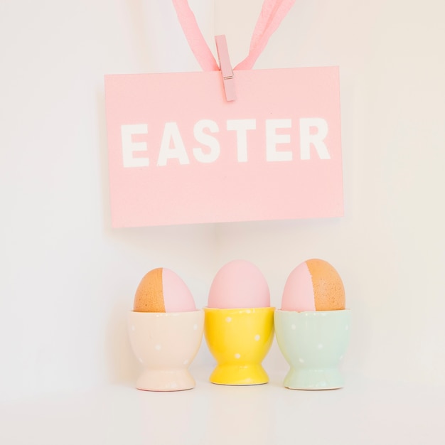 Free photo easter paper and eggs in holders