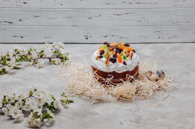 Easter pastries and eggs on a concrete background