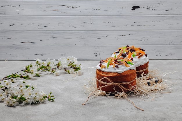 Easter pastries and eggs on a concrete background