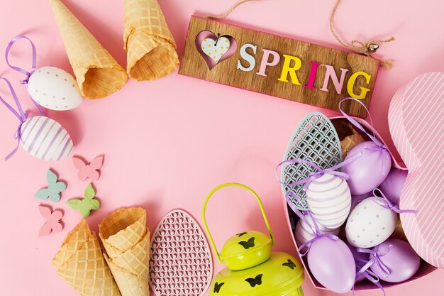 Easter Spring Concept. Flat Lay or Top View of Easter Eggs and Ice Cream Cones. Easter or Spring Background with Place for Text.