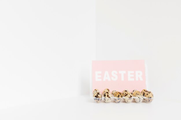 Easter word and quail eggs